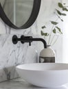 Bathroom interior with stylish black sink and marble washbasin, modern concrete walls Royalty Free Stock Photo