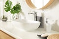 Bathroom interior with vessel sink and decor elements