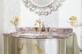 Bathroom interior, vintage mirror and expensive marble washbasin, close-up