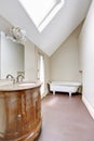 Bathroom interior in white tones with carved vanity cabinet. Royalty Free Stock Photo