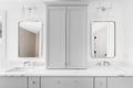 A bathroom with a large grey cabinet and marble countertop. Royalty Free Stock Photo