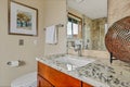 Bathroom with large mirror and granite countertop