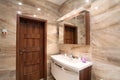 Bathroom in luxury home with bath and furniture Royalty Free Stock Photo