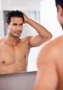 Bathroom mirror, body and man with hair check in a house for skincare, wellness or morning routine. Hairline, reflection