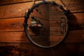 Rustic bathroom mirror with black bats, roses and a reflection in it