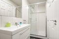 bathroom with one-piece white porcelain sink on lacquered wood