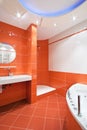 Bathroom in orange and white colors Royalty Free Stock Photo