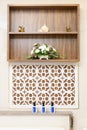 Bathroom partial interior with wooden shelf