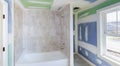 Bathroom remodel progresses as drywall is smoothed, covering seams and screws with tape Royalty Free Stock Photo