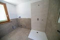 Bathroom after renovation. New stone tiles on the bath room floor.  Home renovation and improvement concept Royalty Free Stock Photo