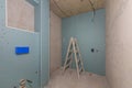Bathroom Renovation in Progress with Moisture-Resistant Drywall Installation. Royalty Free Stock Photo