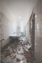 Bathroom renovation - removing tiles in old apartment bathroom Royalty Free Stock Photo