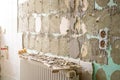 Bathroom renovation - removing tiles in old apartment bathroom from drywall Royalty Free Stock Photo