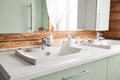 The bathroom in a rustic log cabin, in the mountains. with a beautiful interior. house of pine logs Royalty Free Stock Photo