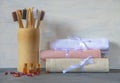 Eco-friendly personal hygiene items made of natural materials. Toothbrushes, linen towels, and bottles of rose oil Royalty Free Stock Photo