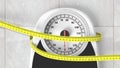 Bathroom scale with measuring tape Royalty Free Stock Photo