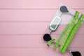 Bathroom scale, measuring tape and space for text on pink wooden floor, top view. Weight loss concept Royalty Free Stock Photo