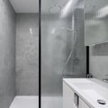 Bathroom with shower behind reinforced glass wall Royalty Free Stock Photo