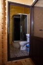 Bathroom with shower, toilet, and sink in wooden house Royalty Free Stock Photo