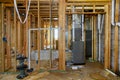 Bathroom shower under plumbing connecting installation of heating system on the basement of the pipe system of heating closeup