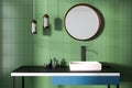 Bathroom sink, green walls and mirror Royalty Free Stock Photo