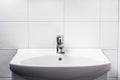 Bathroom sink. Toilet faucet, water tap and WC basin. Public, home or hotel room restroom interior design. Light and clean. Royalty Free Stock Photo