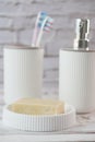 bathroom soap dispenser and toothbrush cup Royalty Free Stock Photo