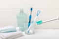 Bathroom with sonic electric toothbrush, toothpaste, mouthwash, dental floss and tongue cleaner Royalty Free Stock Photo