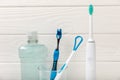 Bathroom with sonic electric toothbrush, toothpaste, mouthwash, dental floss and tongue cleaner Royalty Free Stock Photo