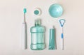 Bathroom with sonic electric toothbrush, toothpaste, mouthwash, dental floss and tongue cleaner Royalty Free Stock Photo