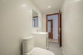 Bathroom with square white porcelain sink with square frameless