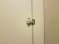 Bathroom stall door with metal lock or bolt Royalty Free Stock Photo