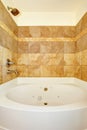 Bathroom with tile wall trim and white bath tub Royalty Free Stock Photo