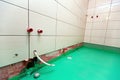 Bathroom with tiled walls and floor painted by green colored waterproof finish material in apartment is inder Royalty Free Stock Photo