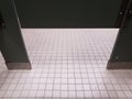 Bathroom tiles and bathroom or restroom stall door Royalty Free Stock Photo