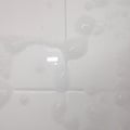Bathroom Tiles With Soap Scum Suds on them. AI Image