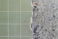 Bathroom tiles wall besides cracked and destroyed undersurface Royalty Free Stock Photo