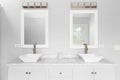 A bathroom with a white cabinet, vessel sinks, and bronze lights above the mirrors. Royalty Free Stock Photo