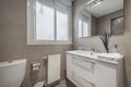 Bathroom with white porcelain sink, square frameless mirror, high gloss