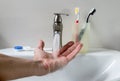 Bathroom white sink, faucet and hygienic set Royalty Free Stock Photo