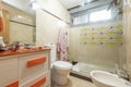 Bathroom wall with a brand new wooden cabinet Royalty Free Stock Photo