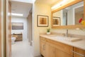 bathroom with woodframed mirror