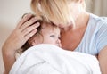 Bathtime cuddles. a baby being cuddled by her mother after a bath. Royalty Free Stock Photo