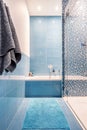 Bathtub in blue bathroom Royalty Free Stock Photo