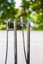 Bathtub faucet with green background Royalty Free Stock Photo