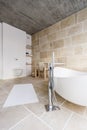 Bathtub in sand bathroom Royalty Free Stock Photo