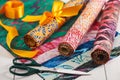 Batik kits turned into rolls tied with a decorative bow