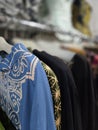 Batik shirts hanged in a cupboard Royalty Free Stock Photo