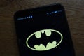 Batman logo displayed on a modern smartphone