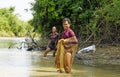 Battambang, cambodia - circa january 2024: local fisherman catching fish in the tonle sap river